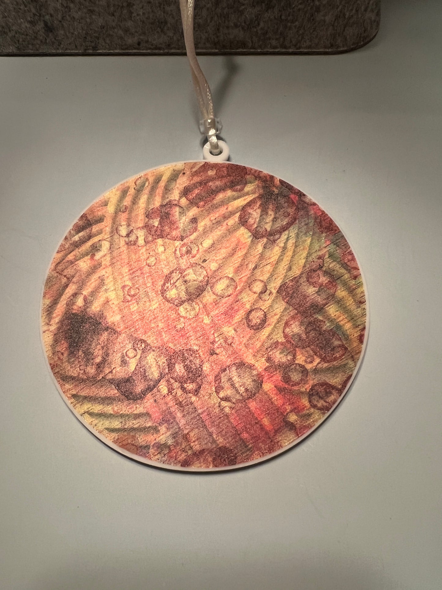 Acrylic White Yarn Ball Suncatcher/Ornament with brown and gold background