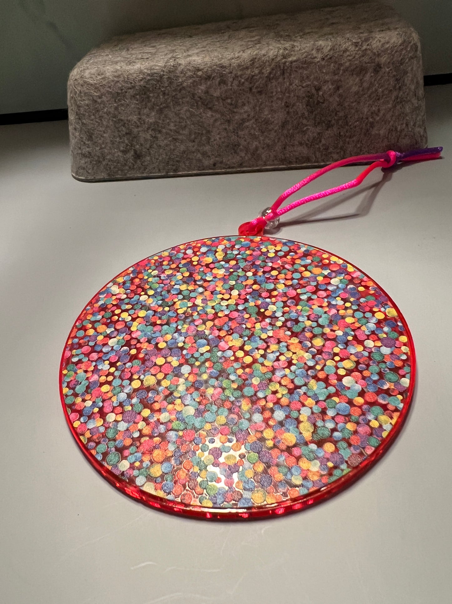 Acrylic Yarn Ball Suncatcher/Ornament Hot Pink/Orange with multi color dot background