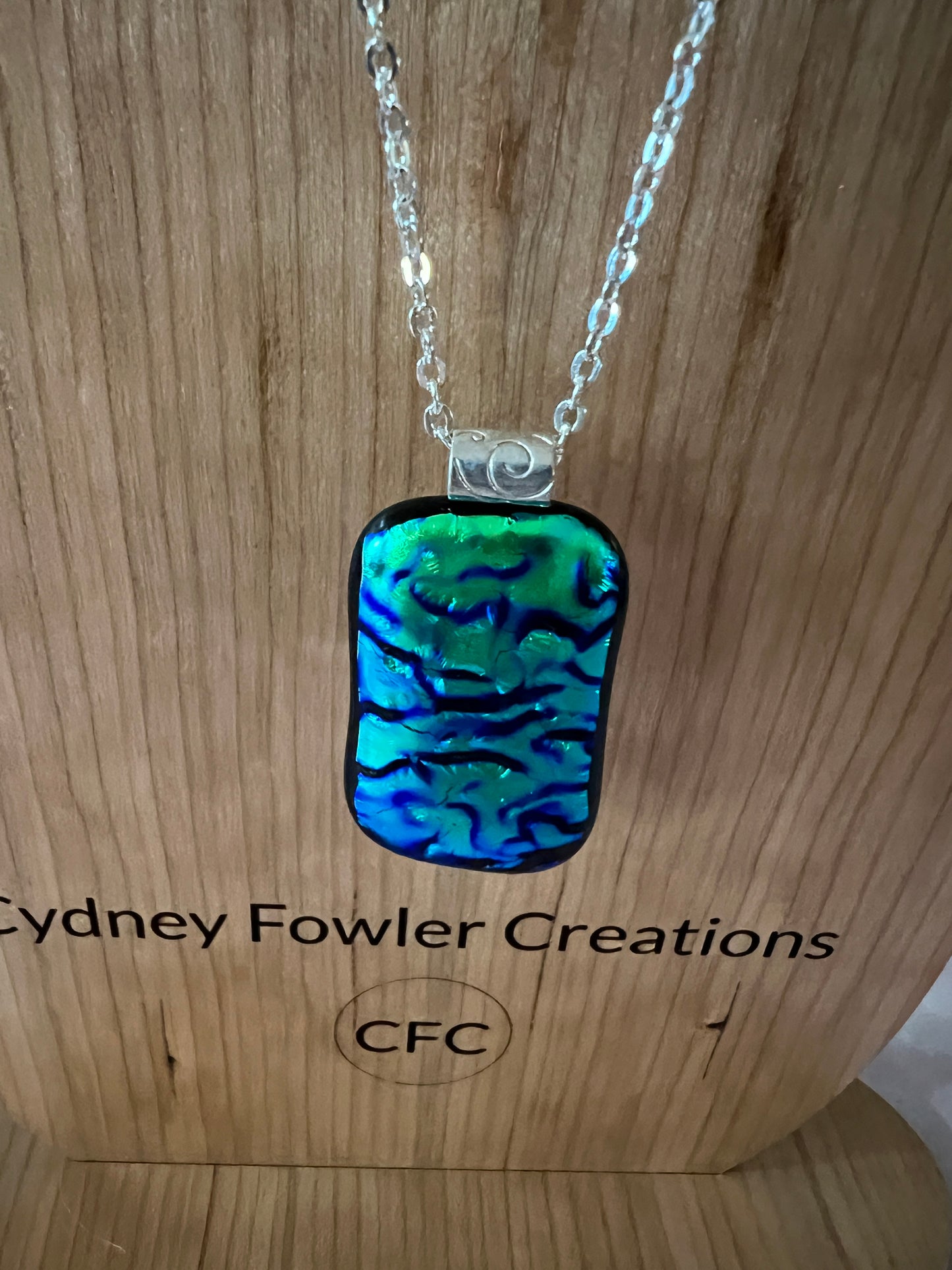 Fused Glass Pendant - blue green dichroic on silver tone bail and chain